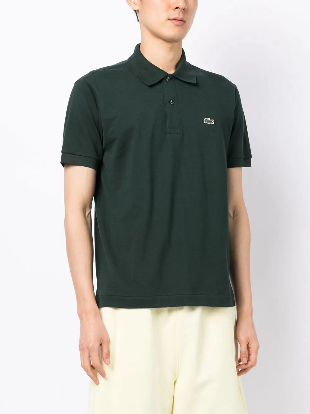 Camisa polo verde escuro com mangas curtas com patch de logo