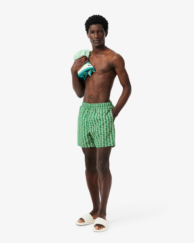 Shorts de banho de comprimento médio com estampa de monograma