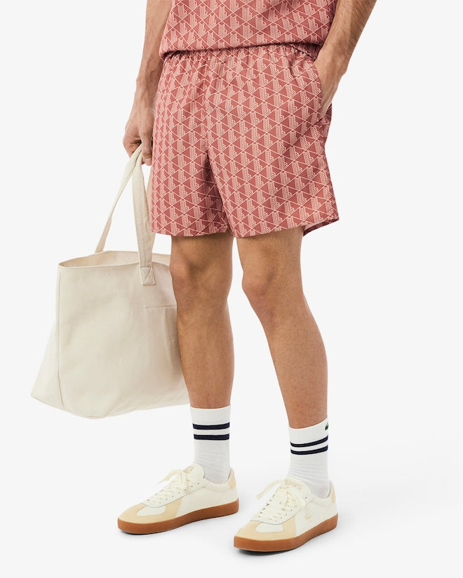 Shorts de banho de comprimento médio com estampa de monograma
