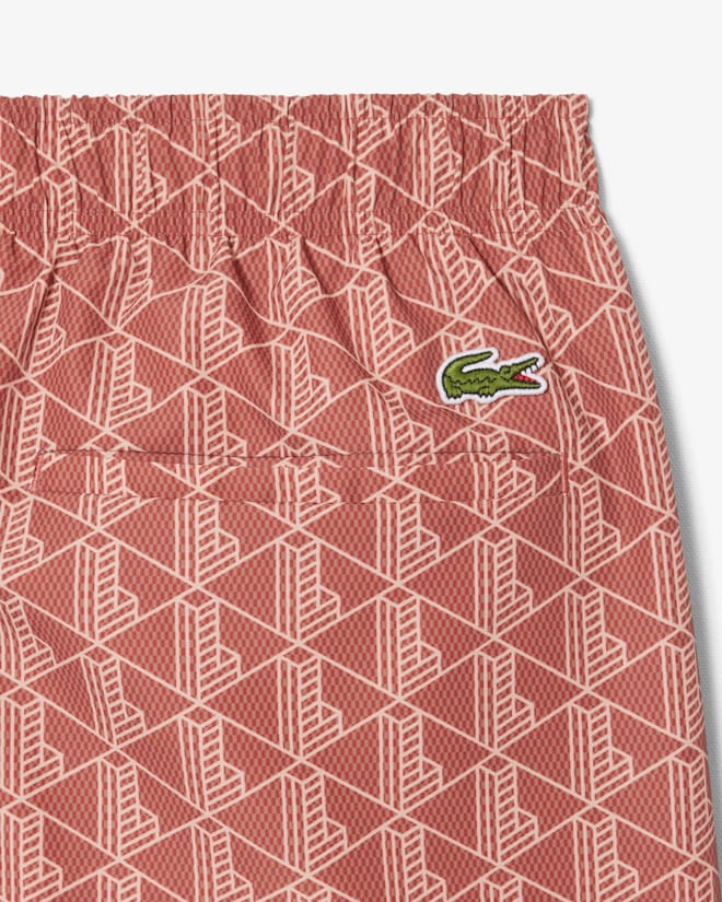 Shorts de banho de comprimento médio com estampa de monograma