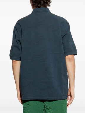 Camisa polo azul com aplicação de crocodilo