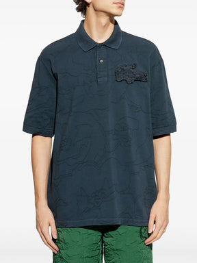 Camisa polo azul com aplicação de crocodilo