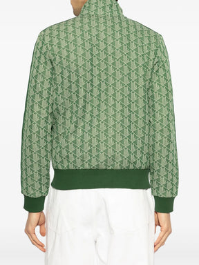 Casaco verde com padronagem monogramada