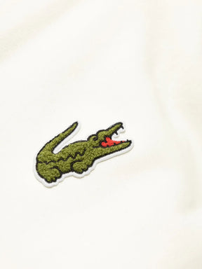 Casaco branco com patch de crocodilo