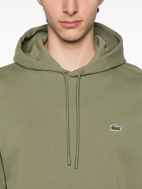 Casaco verde musgo com capuz e patch de logo