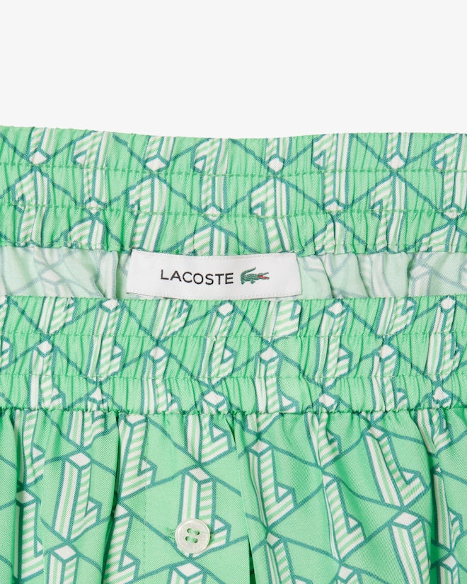 Shorts fluidos com estampa de monograma