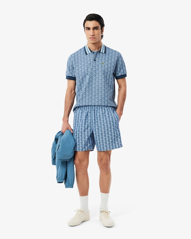 Shorts de banho de comprimento médio com estampa de monograma