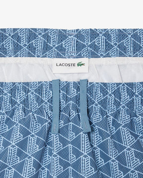 Shorts de banho de comprimento médio com estampa de monograma