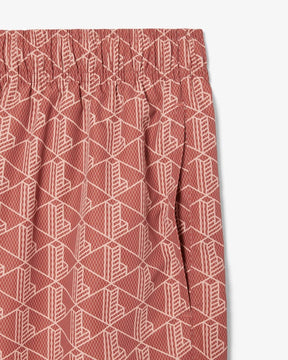 Shorts de banho de comprimento médio com estampa de monograma