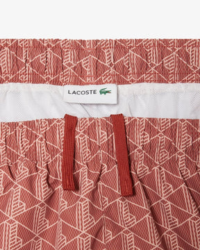 Shorts de banho de comprimento médio com estampa de monograma