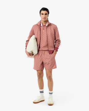 Shorts de banho de comprimento médio com estampa de monograma