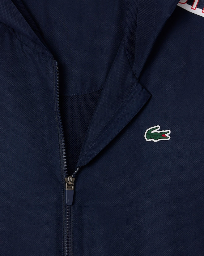 Casaco Desportivo azul escuro com detalhe vermelho com logo