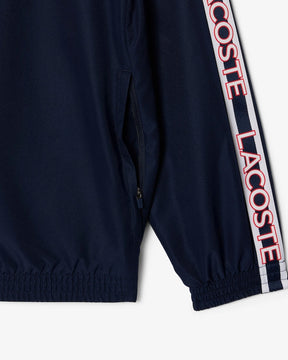 Casaco Desportivo azul escuro com detalhe vermelho com logo